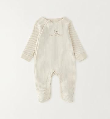 Tutina neonato in cotone panna a costine