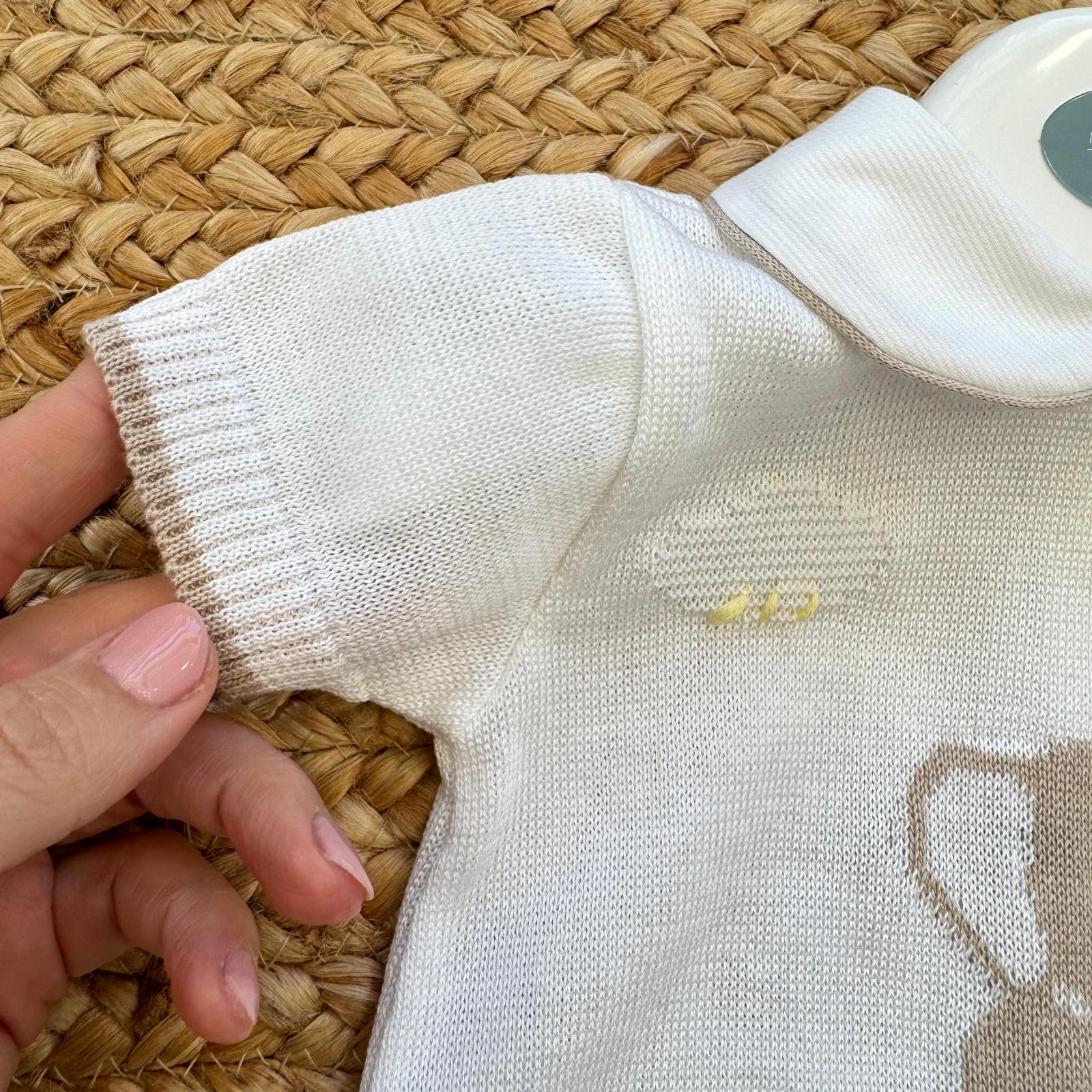 Dettaglio manica tutina neonato in cotone filo di Scozia