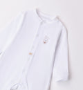  Retro della tutina unisex per neonato con piedini coperti.