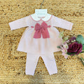 Tutina neonata in pura lana con maxi fiocco rosa e colletto ricamato

