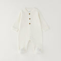 Tutina unisex neonato in caldo cotone bianco latte con bottoncini e piedini chiusi