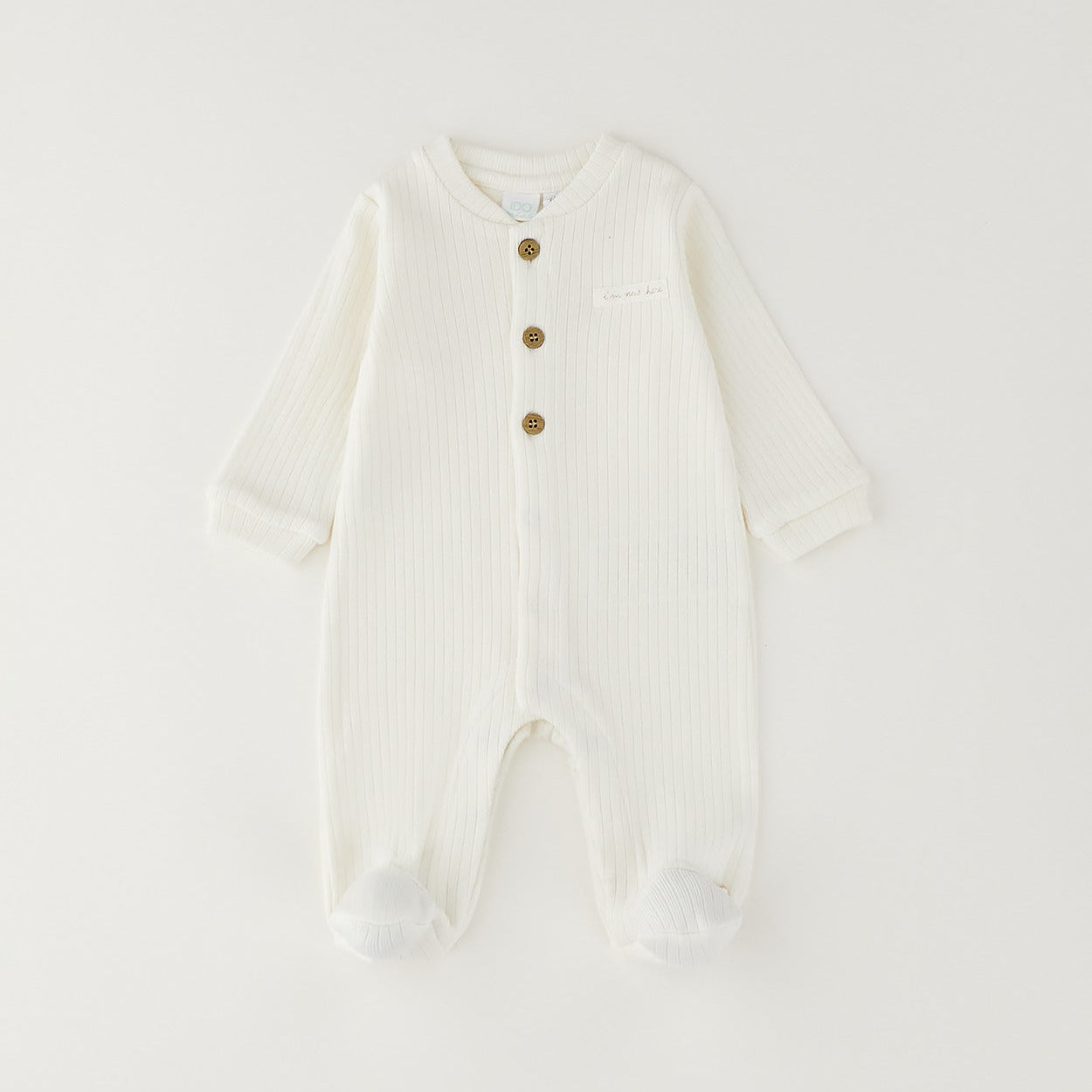 Tutina unisex neonato in caldo cotone bianco latte con bottoncini e piedini chiusi
