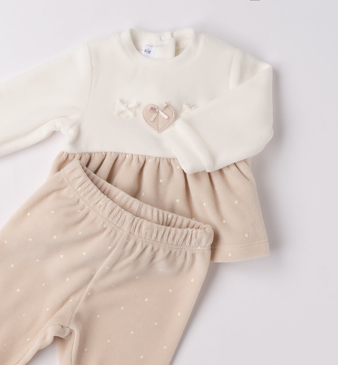 tutina ciniglia neonata panna e beige piegata con gonnellina a pois