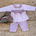 tutina neonata in ciniglia rosa con fiocco ricamato a mano