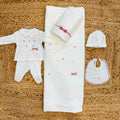 Uscita clinica neonata in ciniglia panna con copertina sfoderabile e fiocchi rosa Made in Italy.