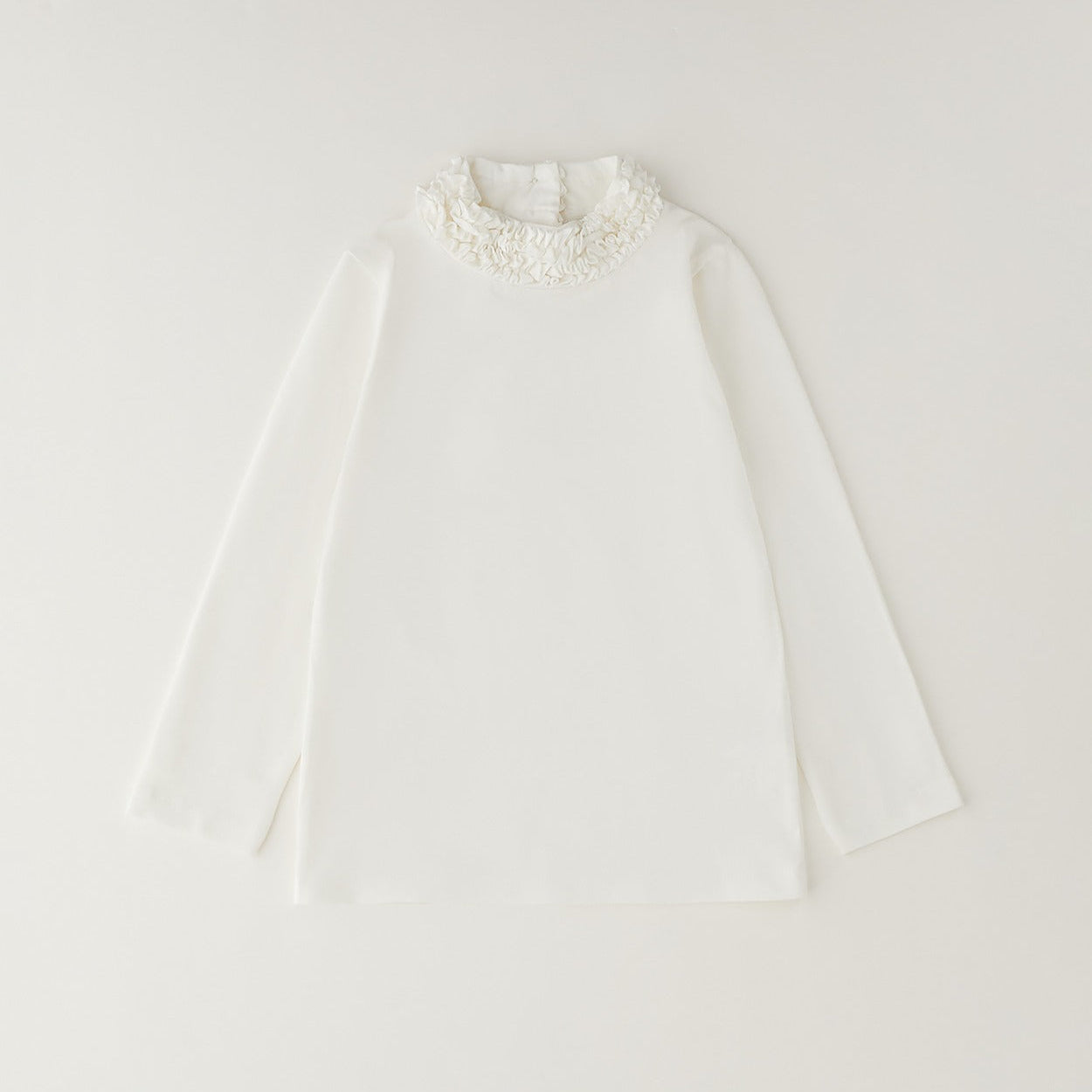 Maglia bimba color panna in cotone con manica lunga e collo alto con ruches