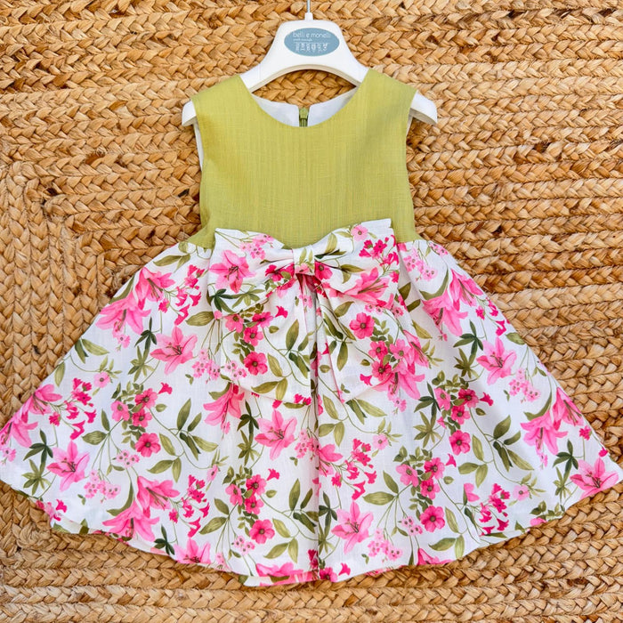 Vestito bambina elegante con corpetto verde pistacchio e gonna floreale rosa con fiocco in vita.