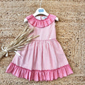 Vestito estivo bambina a righe rosa con volant e grande fiocco dietro
