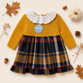 Abitino bimba senape con gonna scozzese tartan e colletto bianco ricamato.