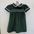 Abito bimba primo compleanno in velluto verde bottiglia con punto smock e colletto panna