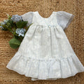Abito bambina estivo in lino bianco con stampa floreale azzurra