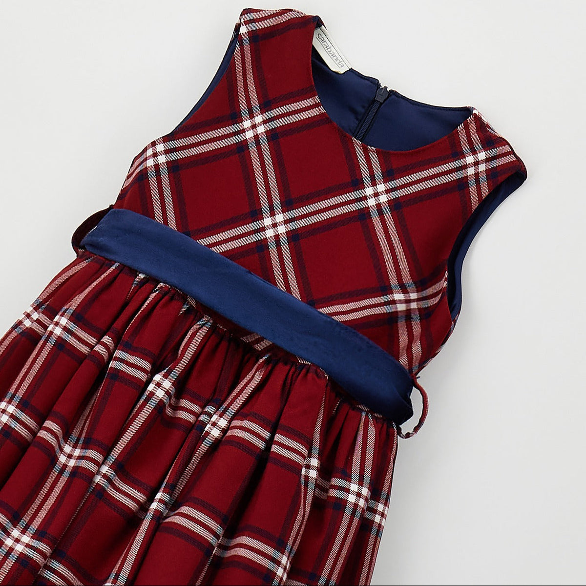 	Abito scozzese bambina Sarabanda rosso con fantasia tartan e fascia blu in vita