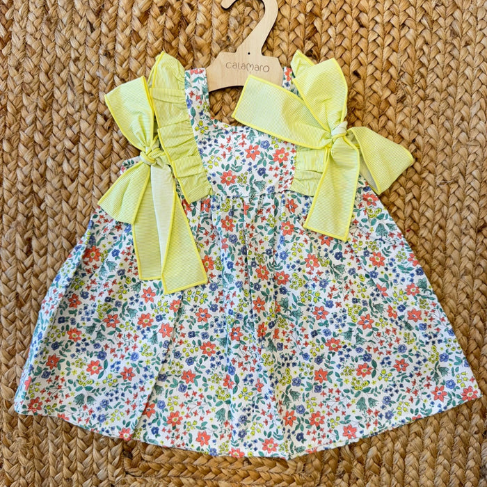 vestitino neonata floreale con fiocchi gialli